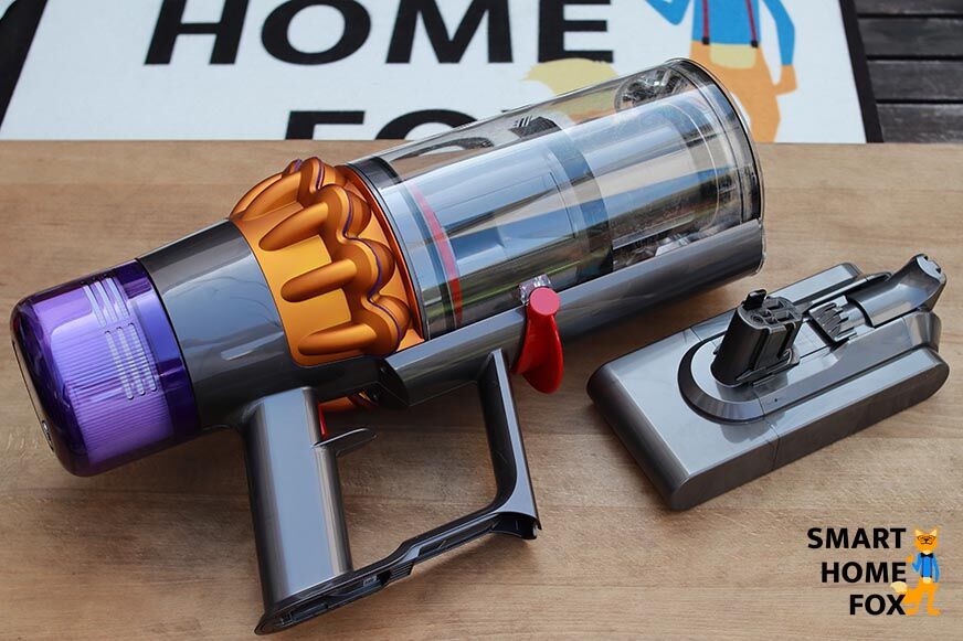 Dyson V15 avec batterie à côté de l'appareil